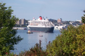 Queen Mary 2 turning to dock at Pier 22. Theodore Tugboat in foreground.